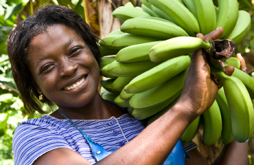 Woman carrying bananas